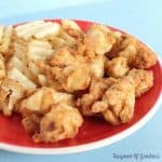 Chick-fil-A Copycat Chicken Nuggets on a plate with waffle fries.