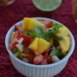 This homemade mango salsa is a simple, delicious, and perfect choice for topping almost any chicken or fish dish. - Teaspoon of Goodness