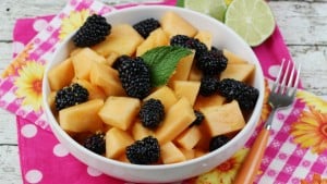 This Cantaloupe & Blackberry Easy Fruit Salad with an Orange Ginger Lime Dressing is ideal for serving up as a great addition to any meal, but even better for a special dinner party. - Teaspoon Of Goodness