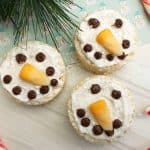 This Snowman Rice Cereal Treats recipe is a classic that takes a holiday shape and turns your favorite dessert into a cute idea everyone will grab on the dessert table. - Teaspoon of Goodness