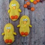 Nutter Butter Cookie dipped in yellow candy melts decorated as an Easter Chick for an Easter Treat