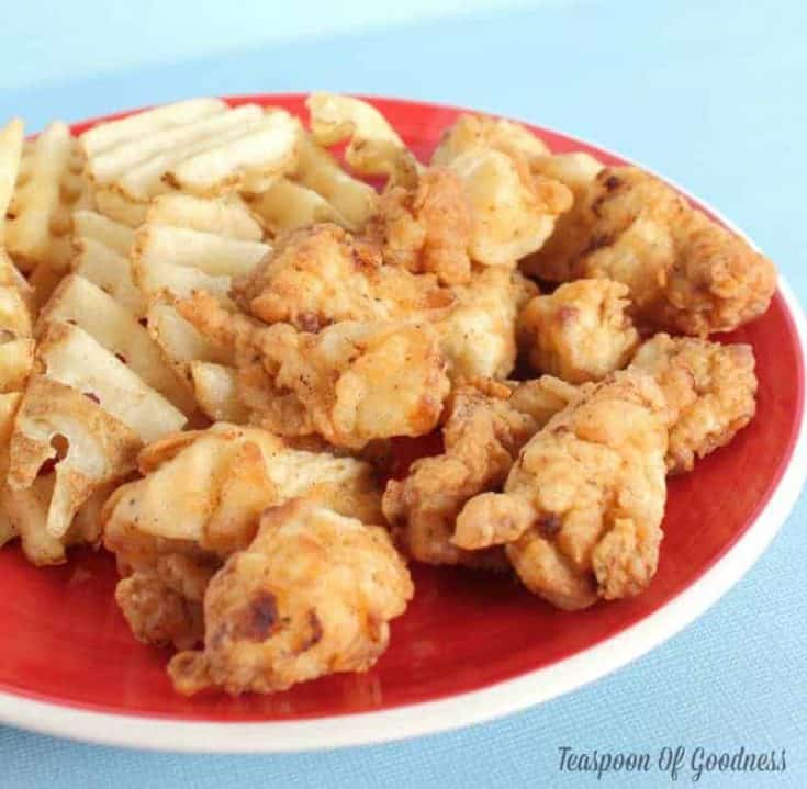 Chick-fil-A Copycat Chicken Nuggets on a plate with waffle fries.