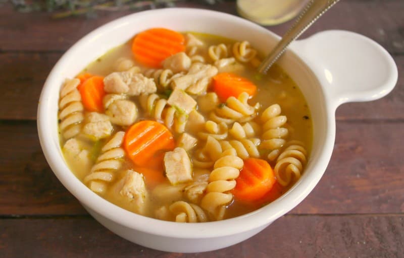 This Easy Chicken Noodle Soup is ready from start to finish in 15 minutes using precooked chicken and frozen veggies. - Teaspoon Of Goodness