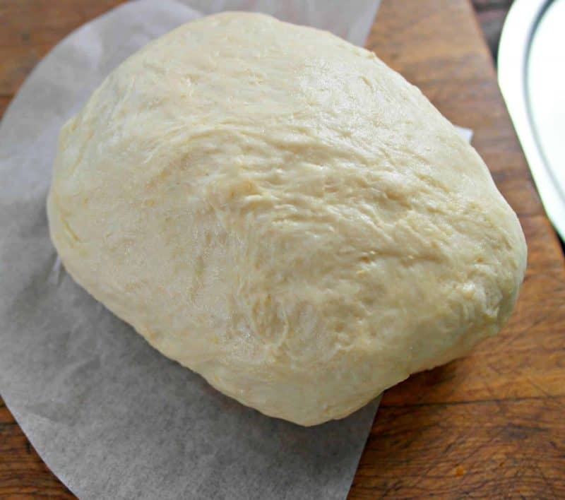 Everyone loves pizza, and this homemade Pizza Crust is a super easy way to make your own custom pizza at home. No need to order takeout from any of the local delivery places. Simply whip up this delicious dough in no time, and then you can top with your favorite pizza toppings. - Teaspoon Of Goodness