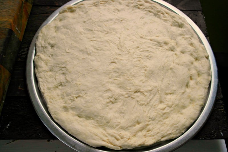 Everyone loves pizza, and this homemade Pizza Crust is a super easy way to make your own custom pizza at home. No need to order takeout from any of the local delivery places. Simply whip up this delicious dough in no time, and then you can top with your favorite pizza toppings. - Teaspoon Of Goodness