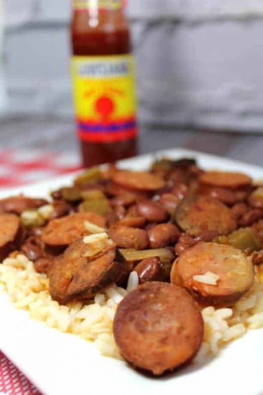 A great Cajun Sausage & Red Beans Recipe is an ideal dish for cool nights. Not only will it be hot and hearty over a bowl of rice, it is a great way to kick up the flavor in your menu plan. - Teaspoon of Goodness