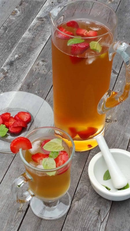 Summer months bring about the need for a great cold drink on hot days, and our Strawberry Mint Iced Tea Recipe is the perfect choice. - Teaspoon of Goodness