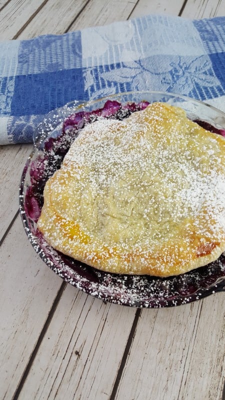 Rustic Blueberry Tart uncut in a pan made with puff pastry for a delicious fresh blueberry tarts recipe. 