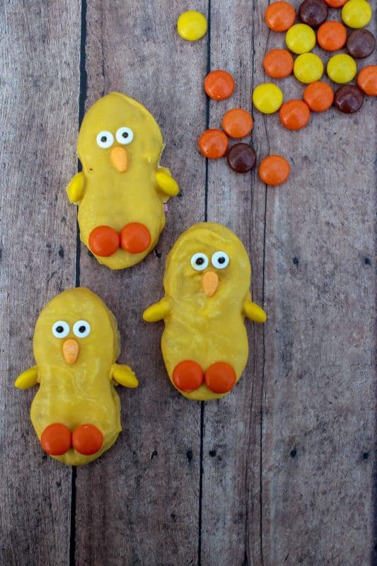 Nutter Butter Cookie dipped in yellow candy melts decorated as an Easter Chick for an Easter Treat