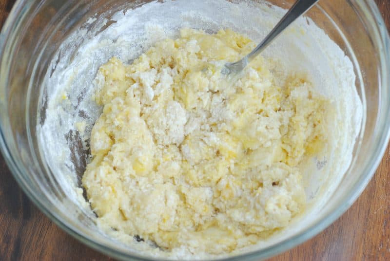 Cake Mix Cookie dough being mixed in a glass bowl. 