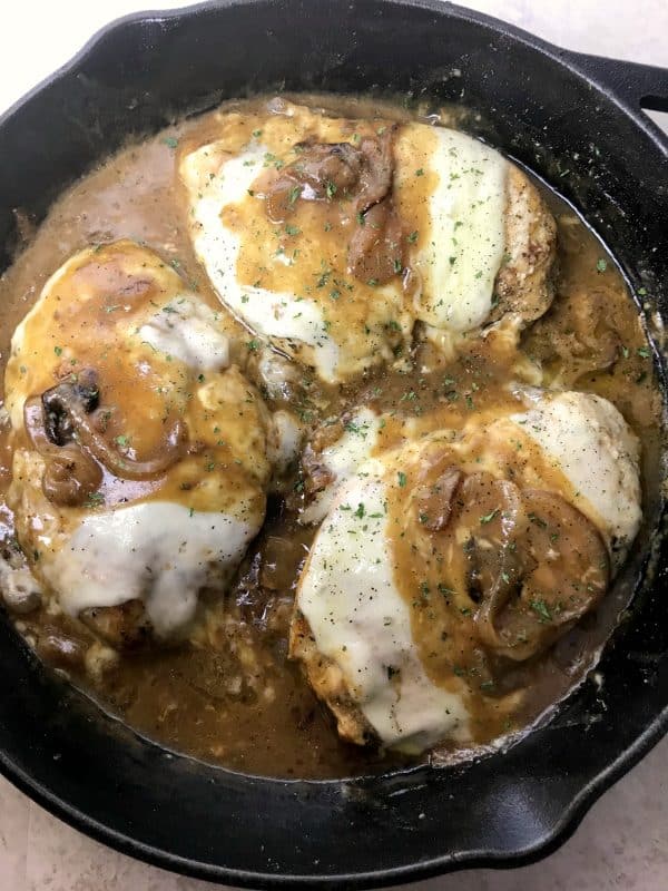 Easy french onion chicken skillet in a cast iron skillet.