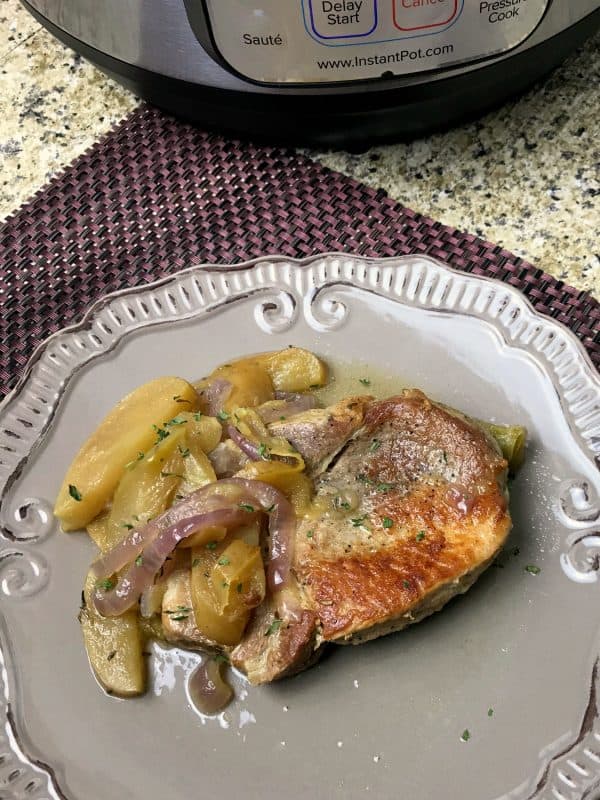 Pork chops, apples and onions cooked in an instant pot.