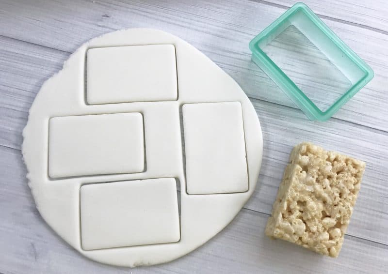 Premade rice crispy treats decorated like notebook paper. 