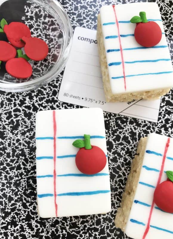 Premade rice crispy treats decorated like notebook paper. 